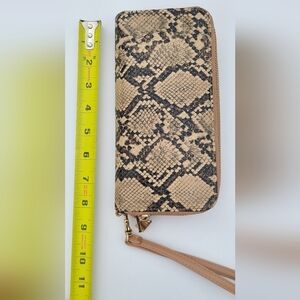 Faux snake skin double sided wallet with wrist strap.‎ a new day